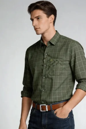Men wearing green crush linen check shirt with rolled sleeves and denim jeans